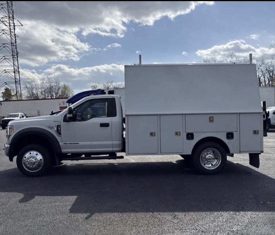 Ford F-550 with Knapheide service body — the fuel cap area that the factory left exposed