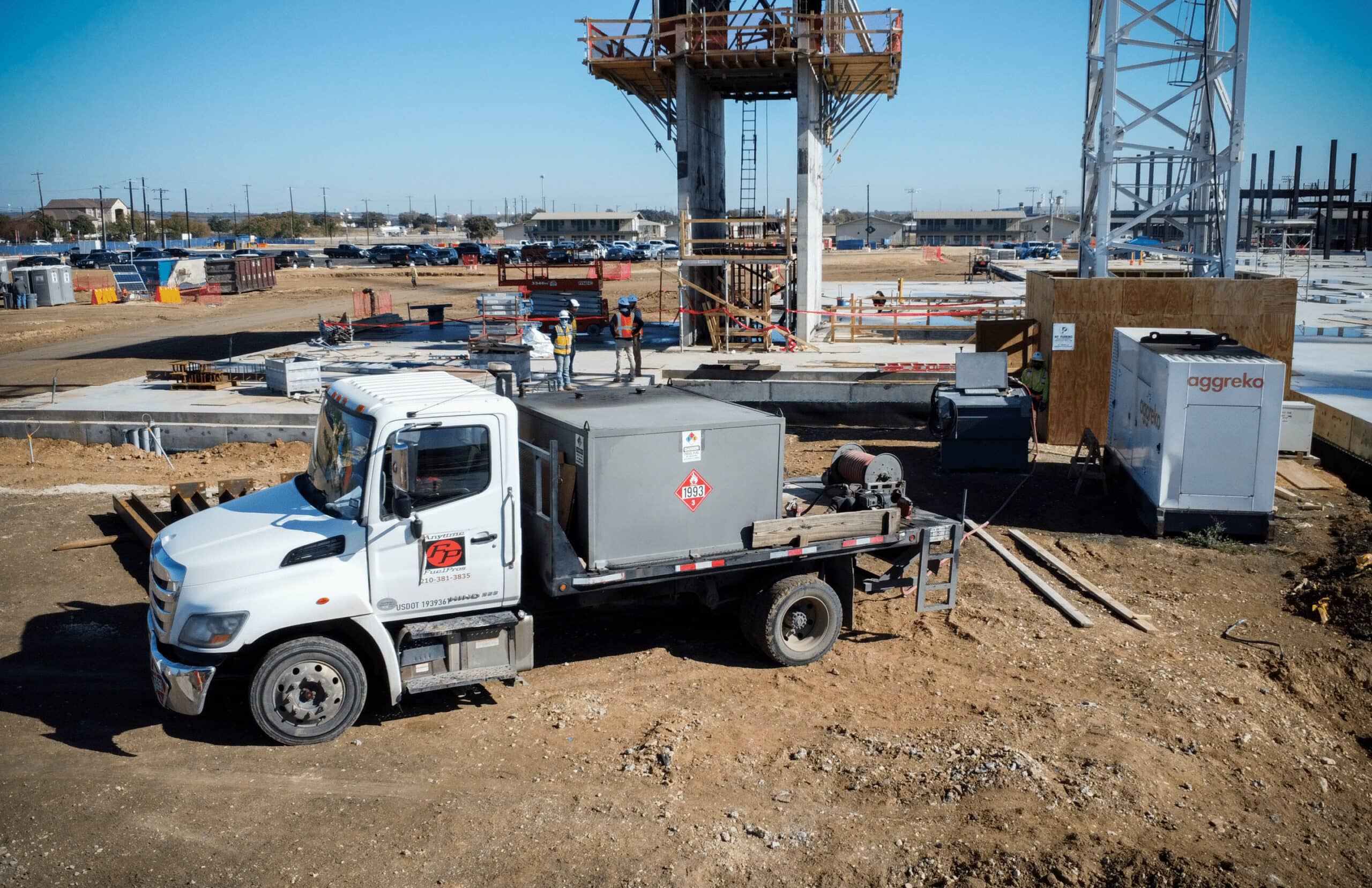 ATG-upfitted work truck at fleet yard with exposed fuel cap — fuel theft risk